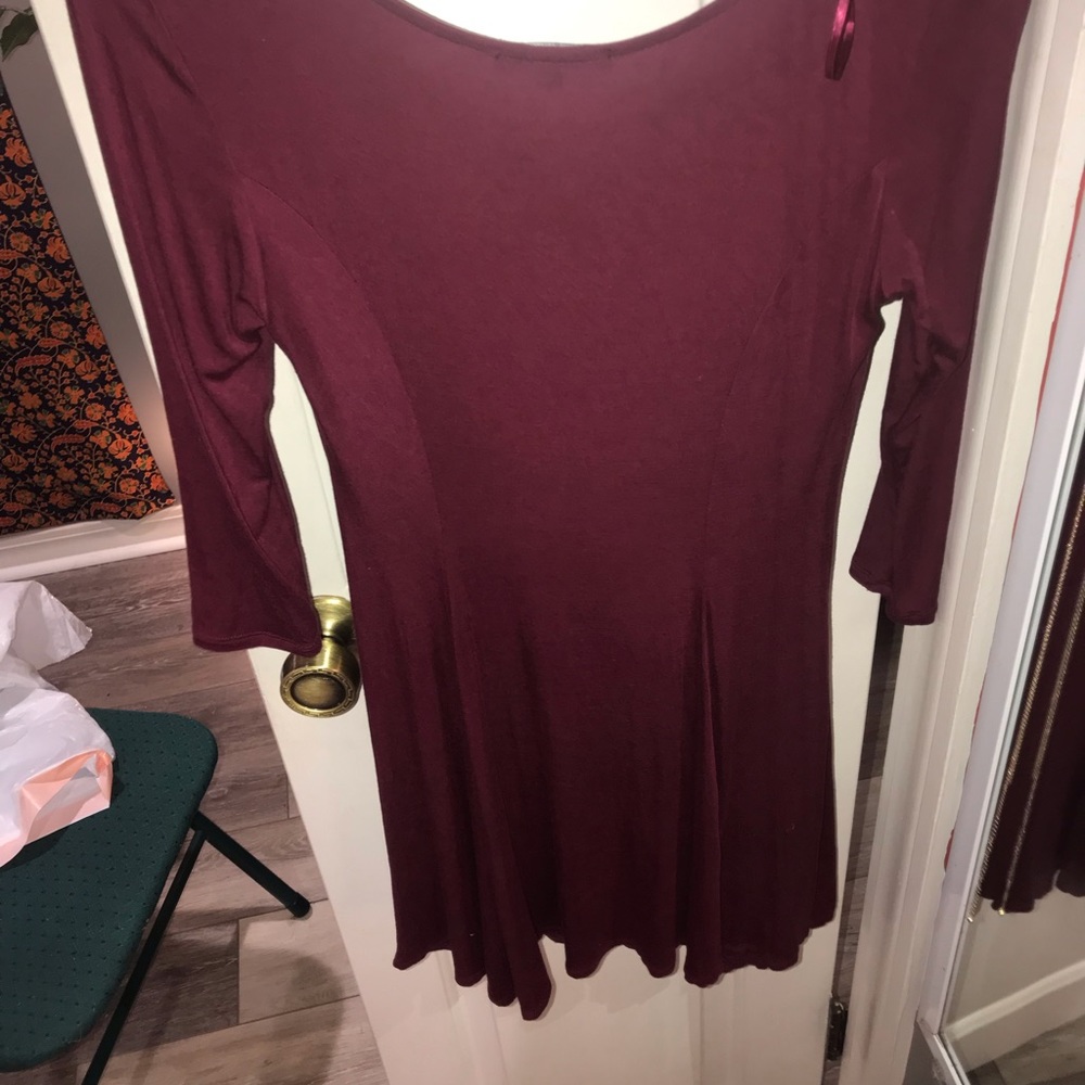 Maroon, form fitting dress.